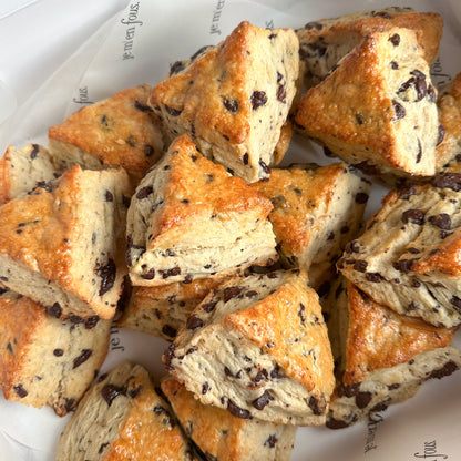 Box filled with mini triangle shaped chocolate chip scones.