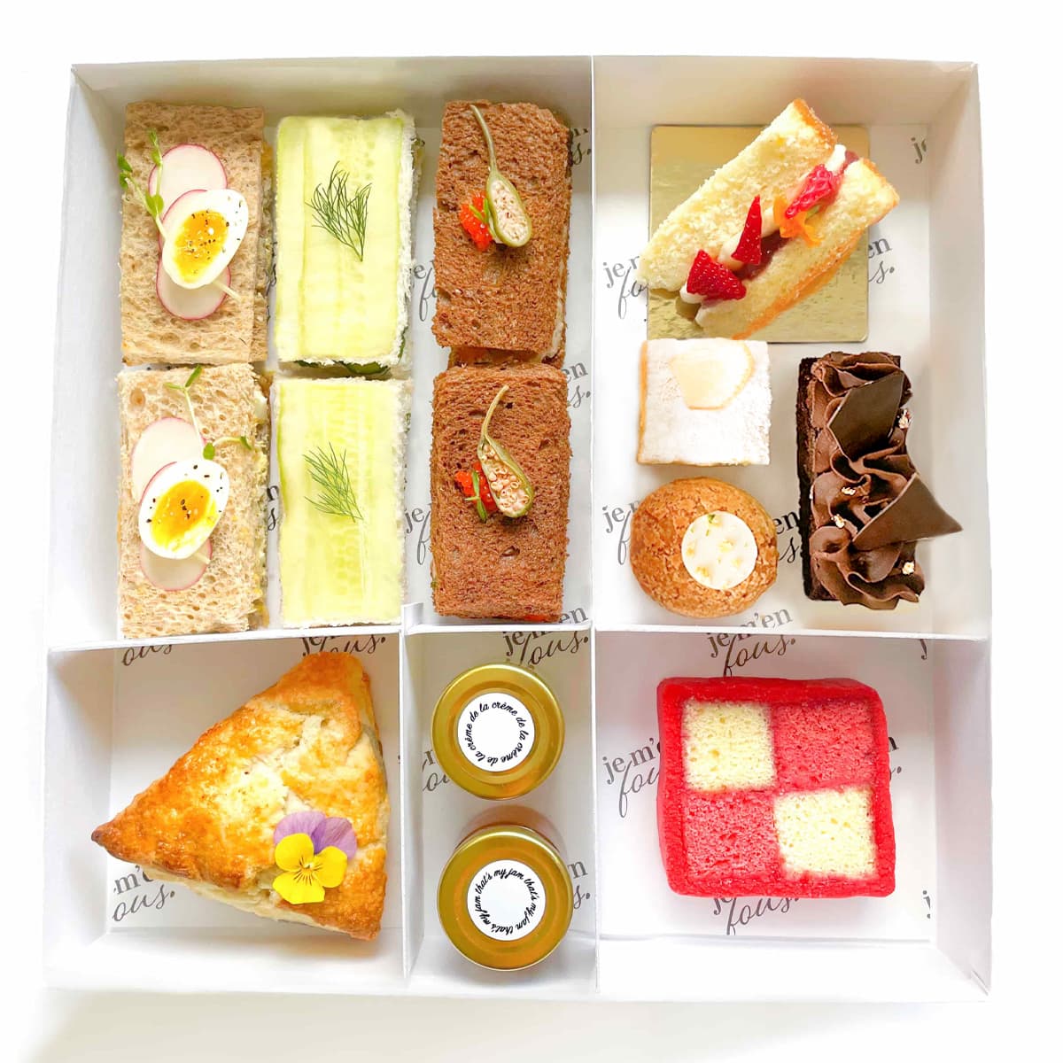 Large tea box with 6 assorted finger sandwiches, triangle scone with jam and clotted cream, mini desserts and cherry battenberg cake.